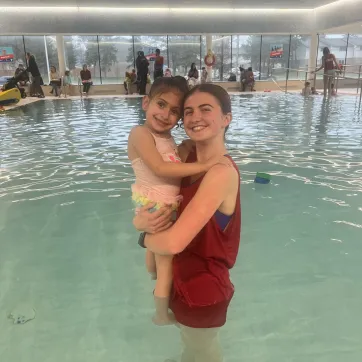 Child and Instructor in Pool