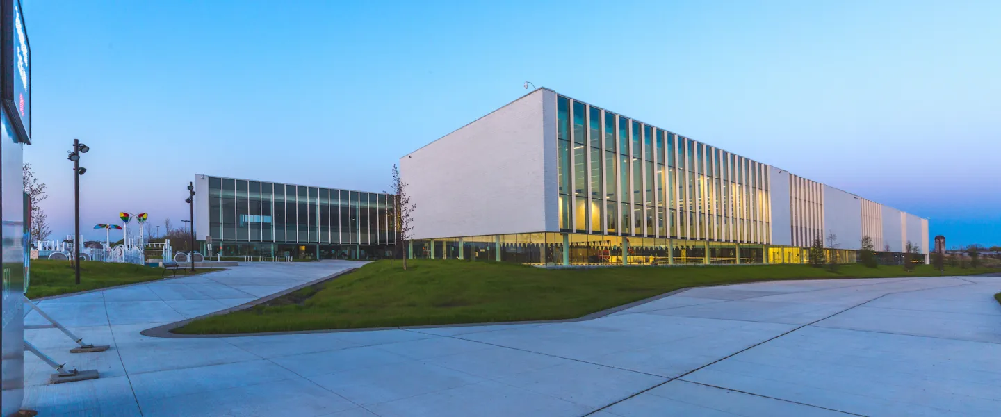 The outside of the Bostwick YMCA facility at dusk.