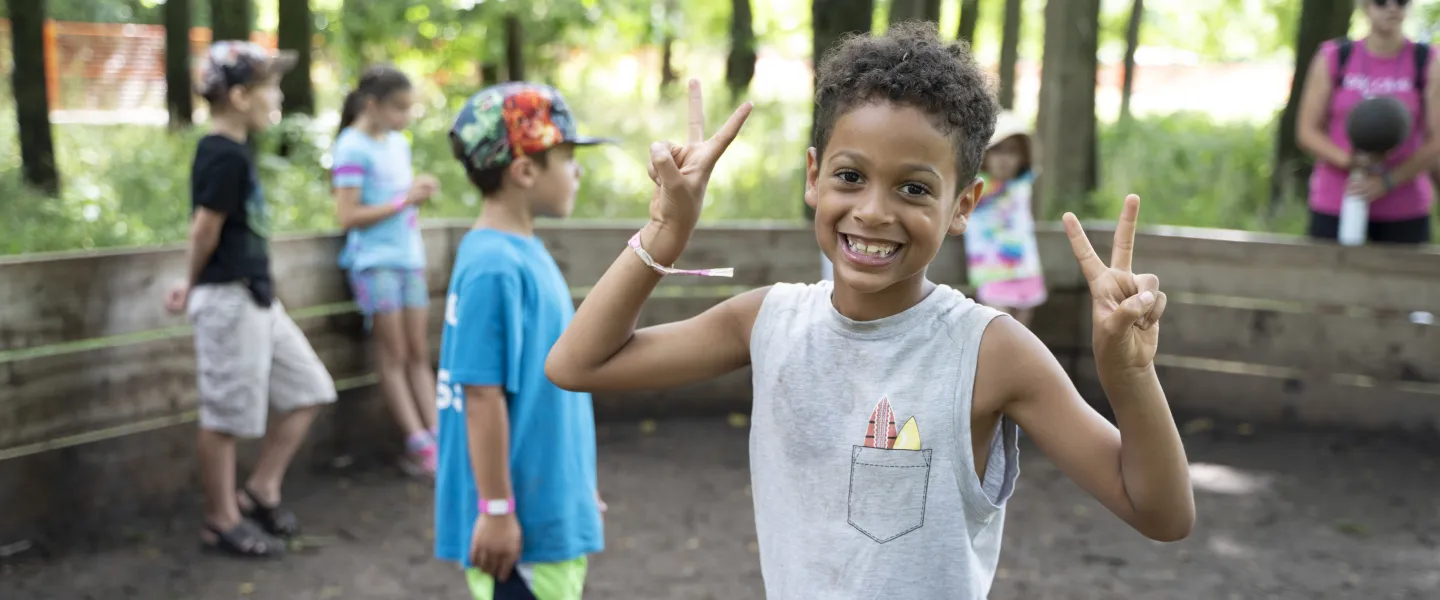 Boy smiling enjoying camp