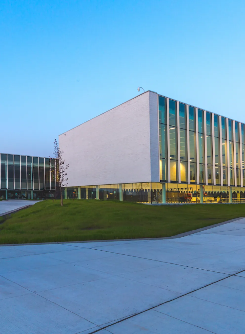 The outside of the Bostwick YMCA facility at dusk.