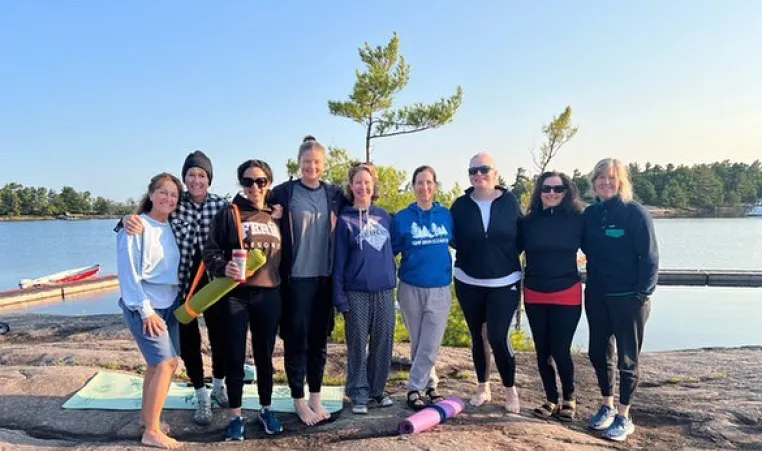 Women on rock after Yoga