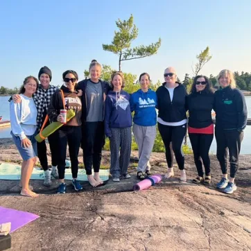 Women on rock after Yoga