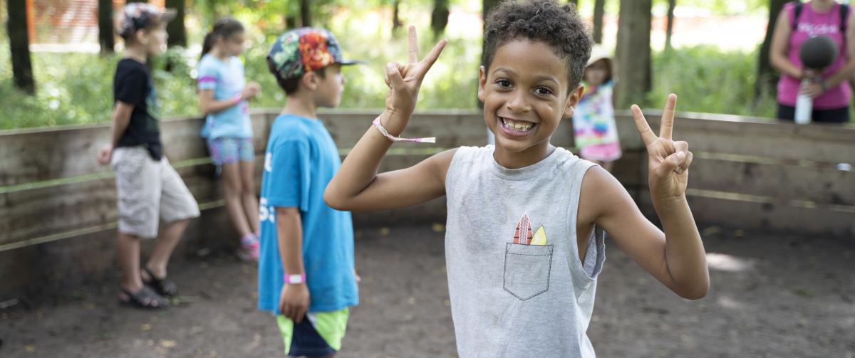 Boy smiling enjoying camp